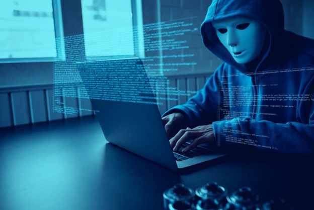 A hacker on a computer.