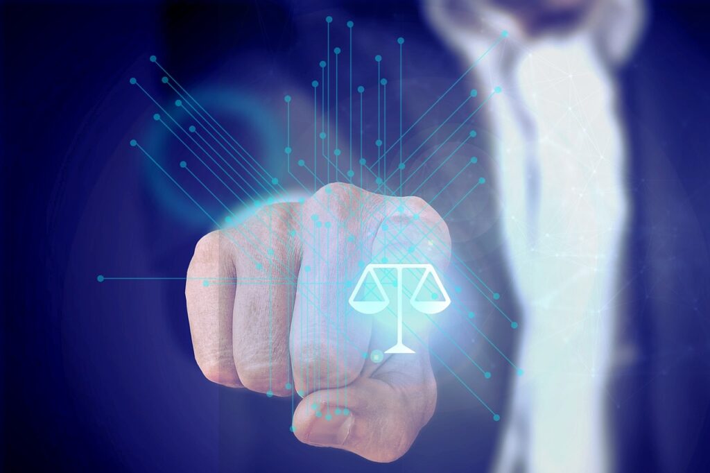 Legaltech and Regtech to combat tech scams. A businessman pressing a holographic scales of justice.