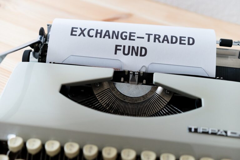 Spot ETF - A typewriter with some paper inside it sayin Exchange-Traded Fund.