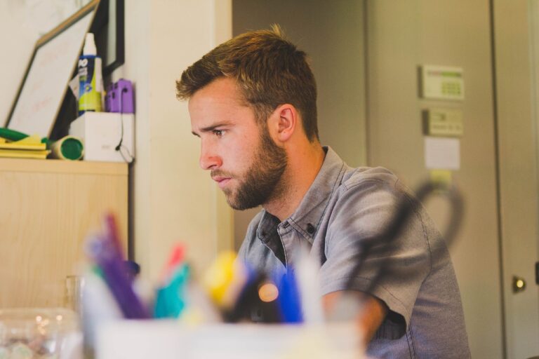 A man working at a desk in the gig economy.