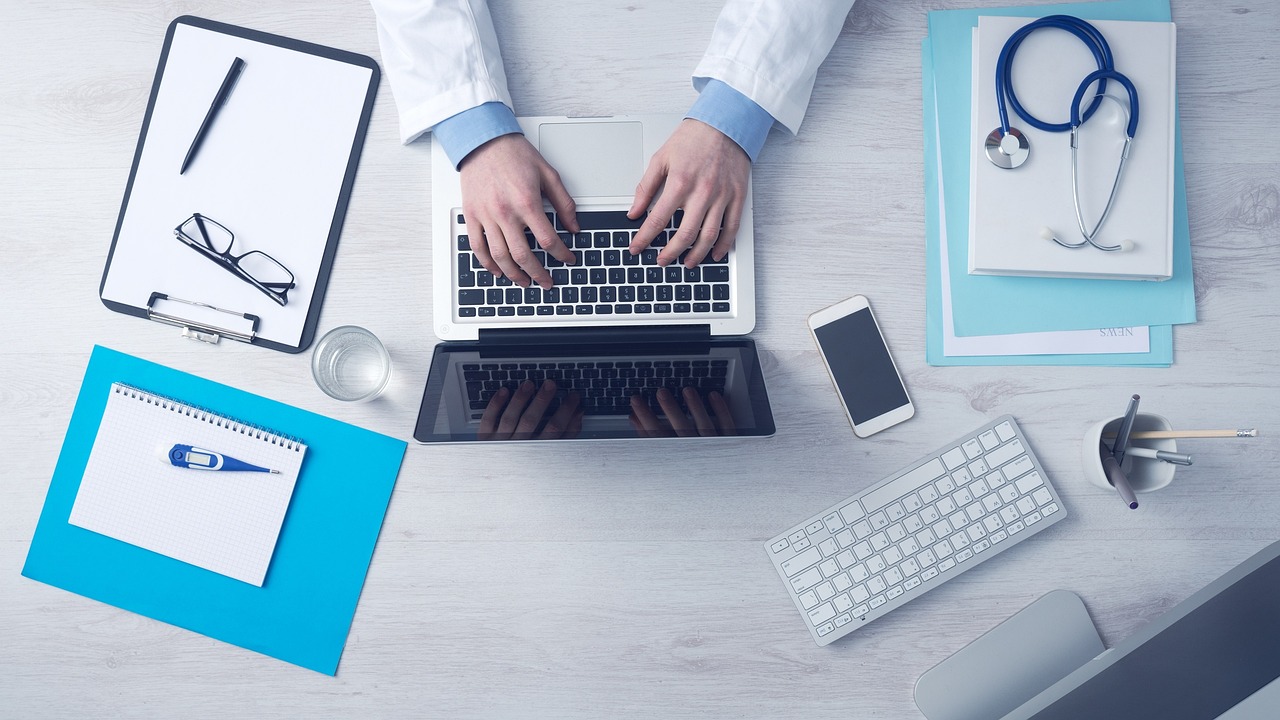 HIPAA rules. A doctor working on a latop.